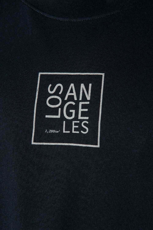 Card slide image -  POLERA  DE MOVIES NEGRA ESTAMPADA EN ESPALDA PARA HOMBRE