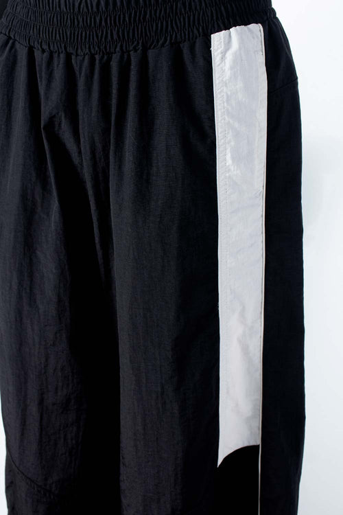 Card slide image -  JOGGER DE MOVIES CON BOTA AJUSTABLE PARA MUJER