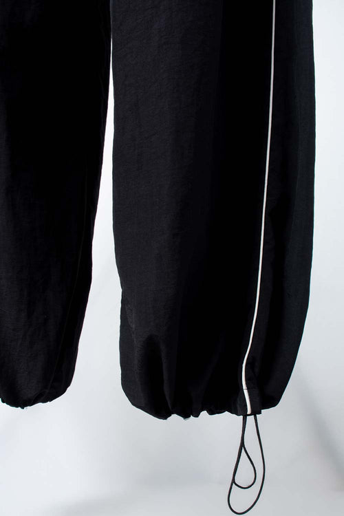 Card slide image -  JOGGER DE MOVIES CON BOTA AJUSTABLE PARA MUJER